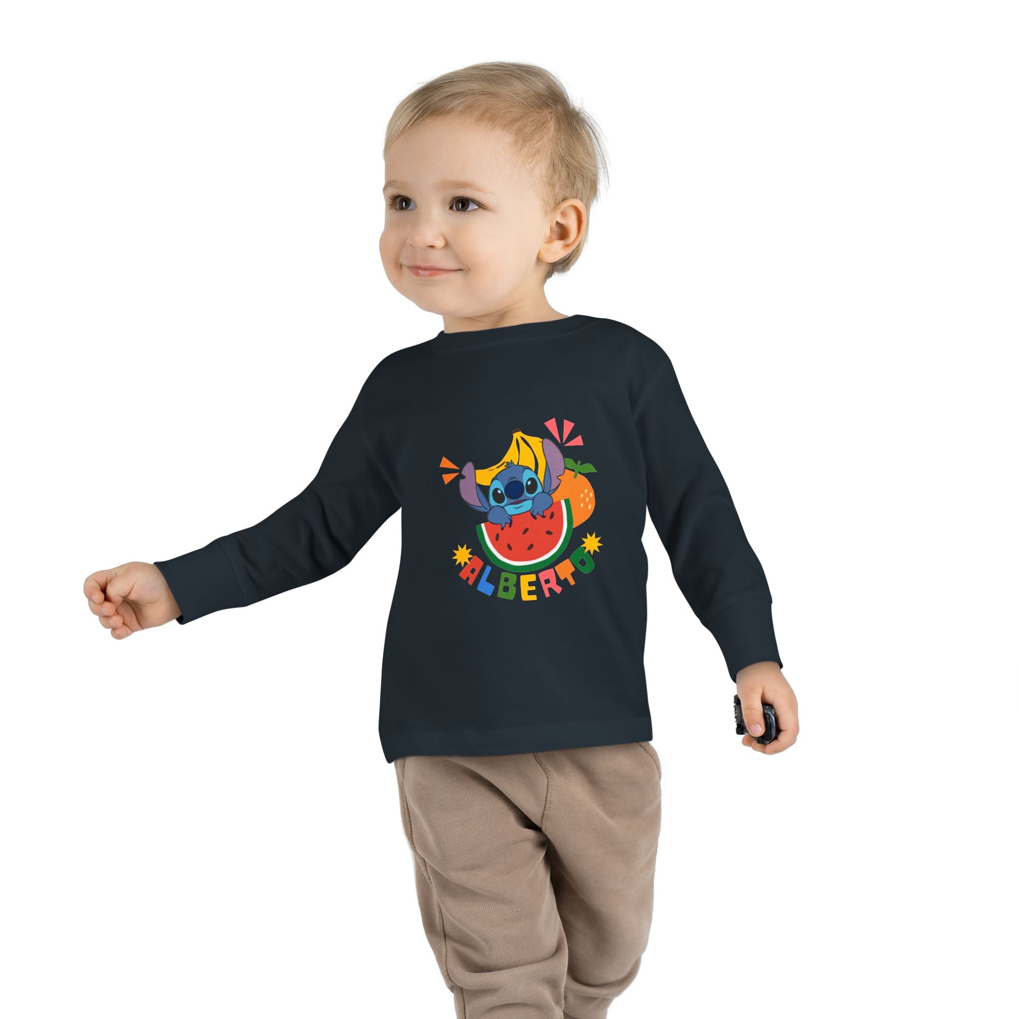 Child wearing a black long-sleeve shirt with colorful graphics and text on a white background