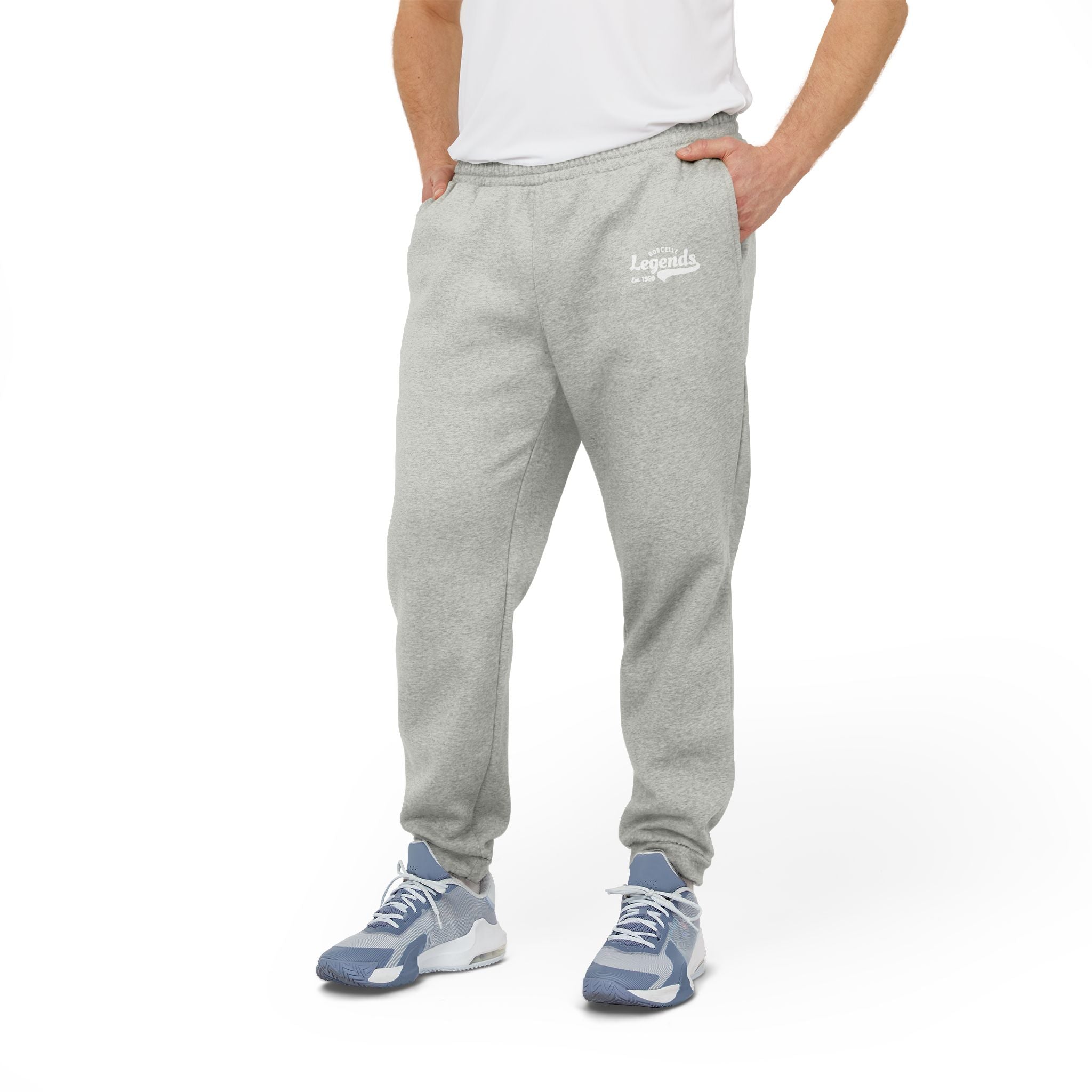 Person wearing gray sweatpants with a logo on a white background
