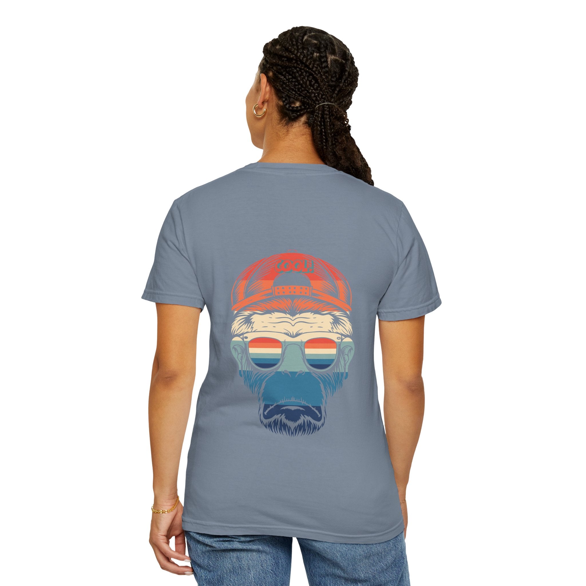 Person wearing a gray t-shirt with a graphic design on the back, standing against a white background.