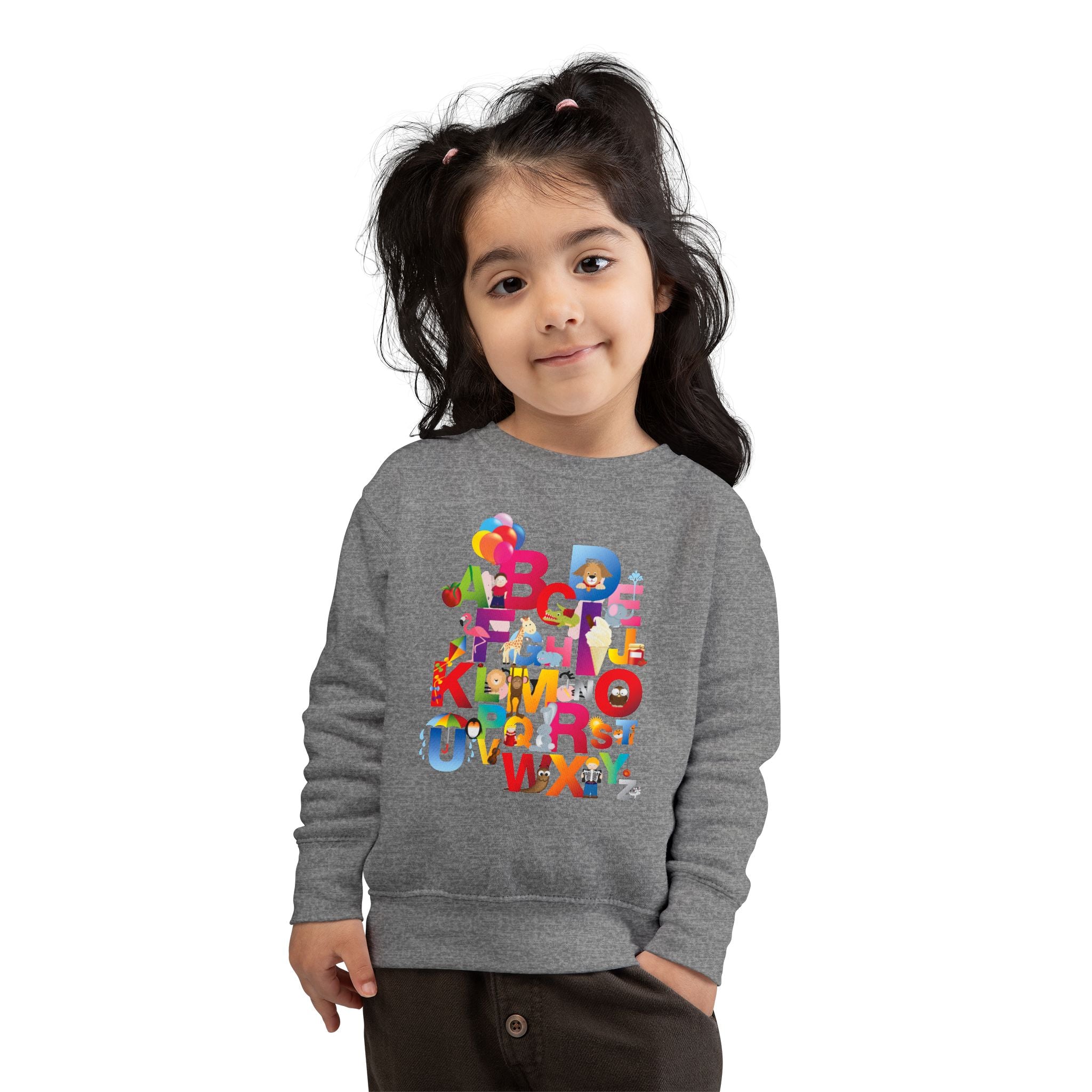 Child wearing a gray sweatshirt with colorful letters and cartoon characters on a white background