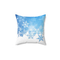 Decorative pillow with snowflake pattern on a blue and white background
