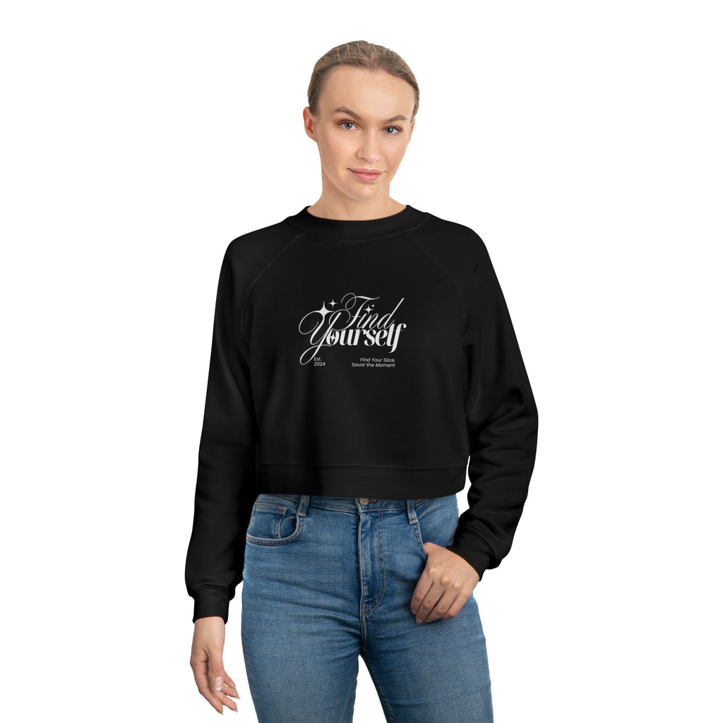 Person wearing a black sweatshirt with text and blue jeans on a white background