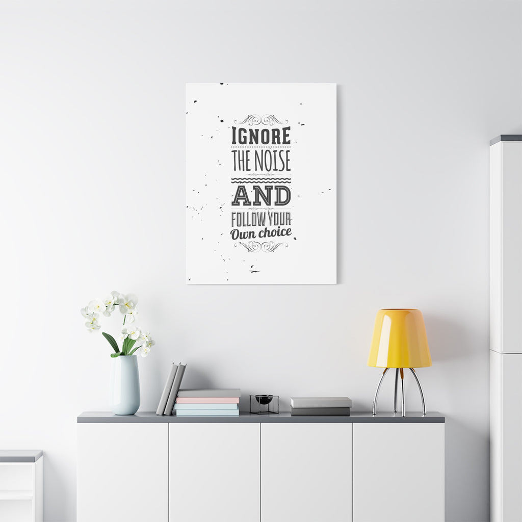Framed motivational poster on a wall with decor items below