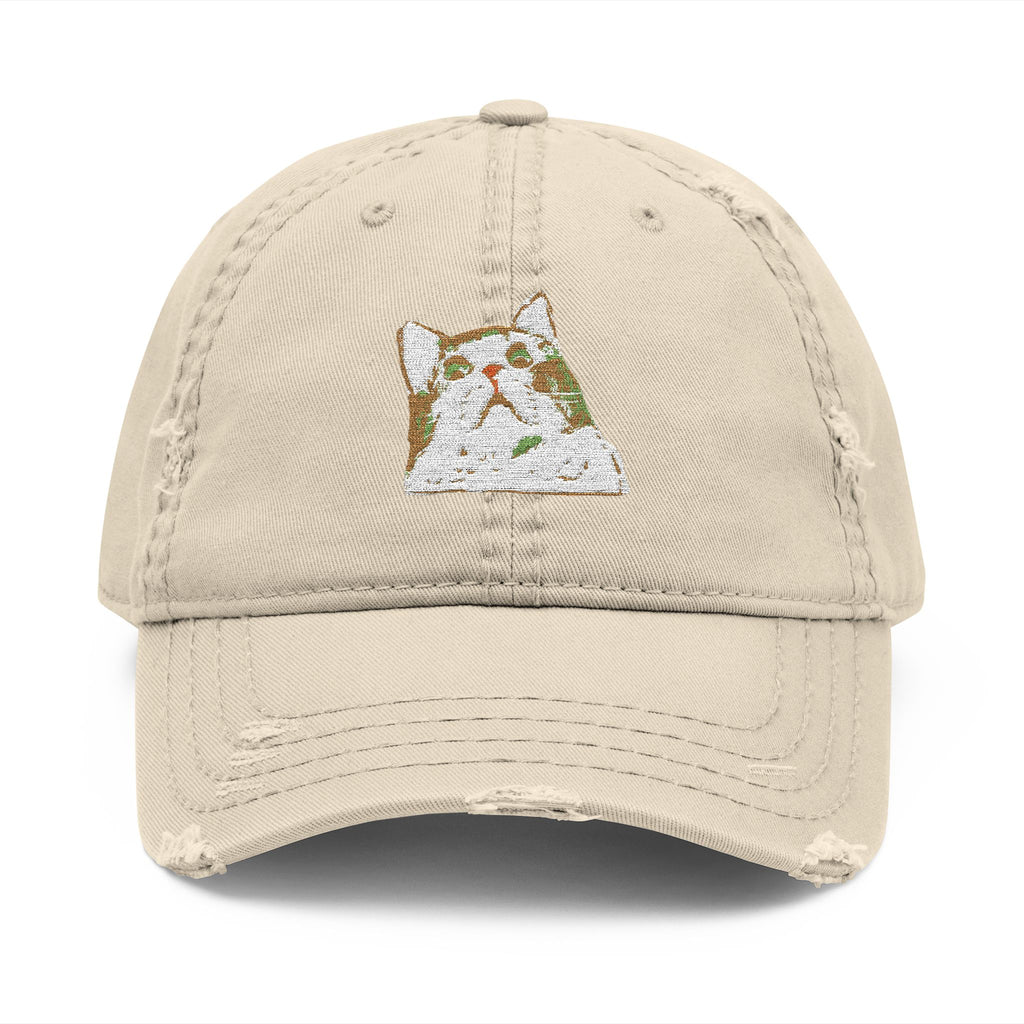 Beige cap with a small embroidered design on a white background