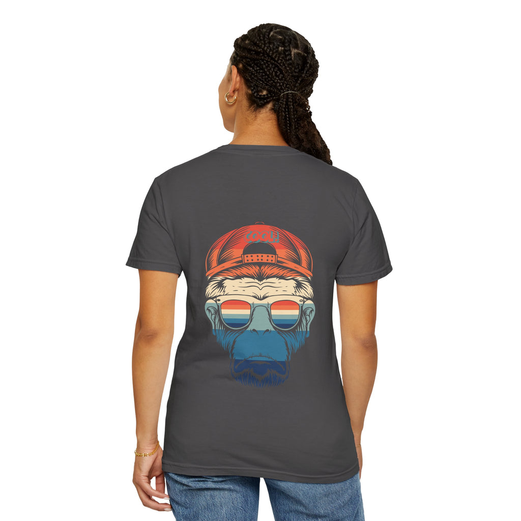 Person wearing a dark gray t-shirt with a colorful graphic on the back, standing against a white background.