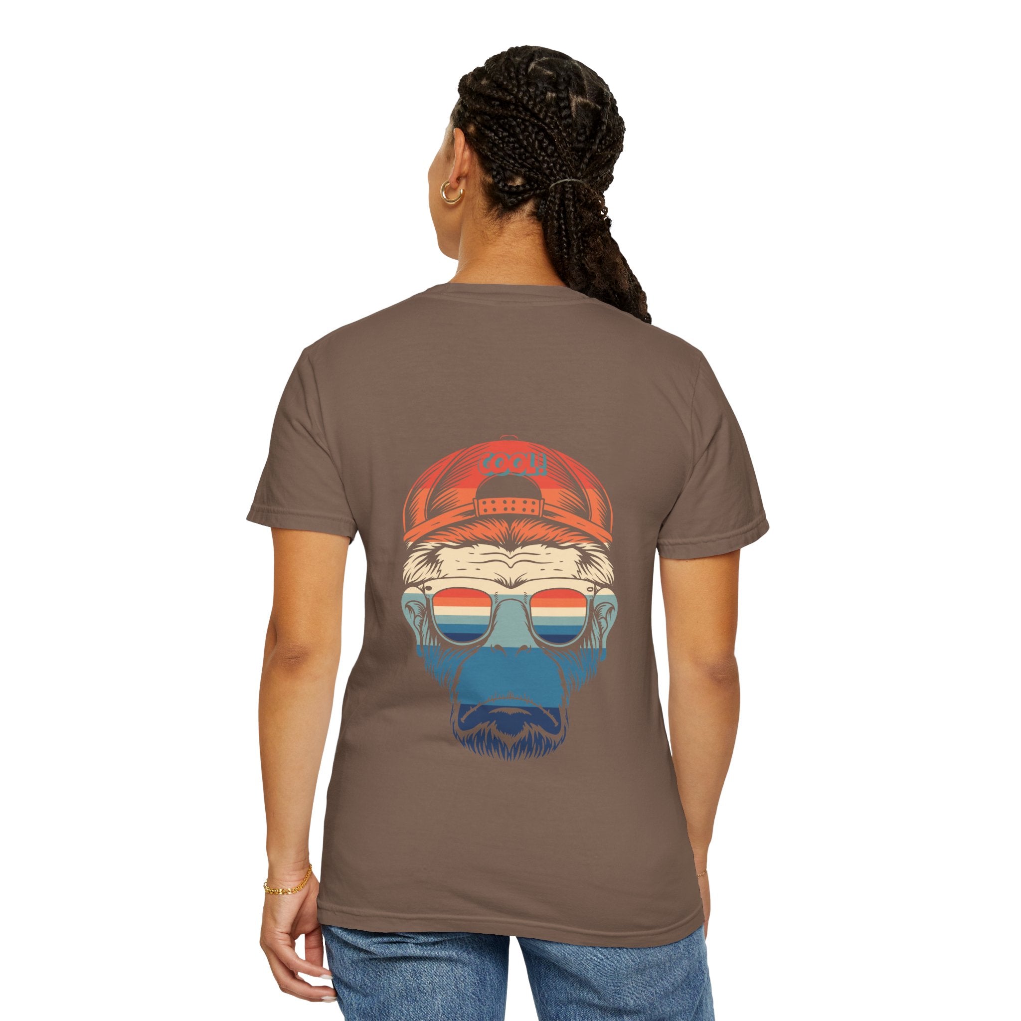 Person wearing a brown t-shirt with a graphic design on the back