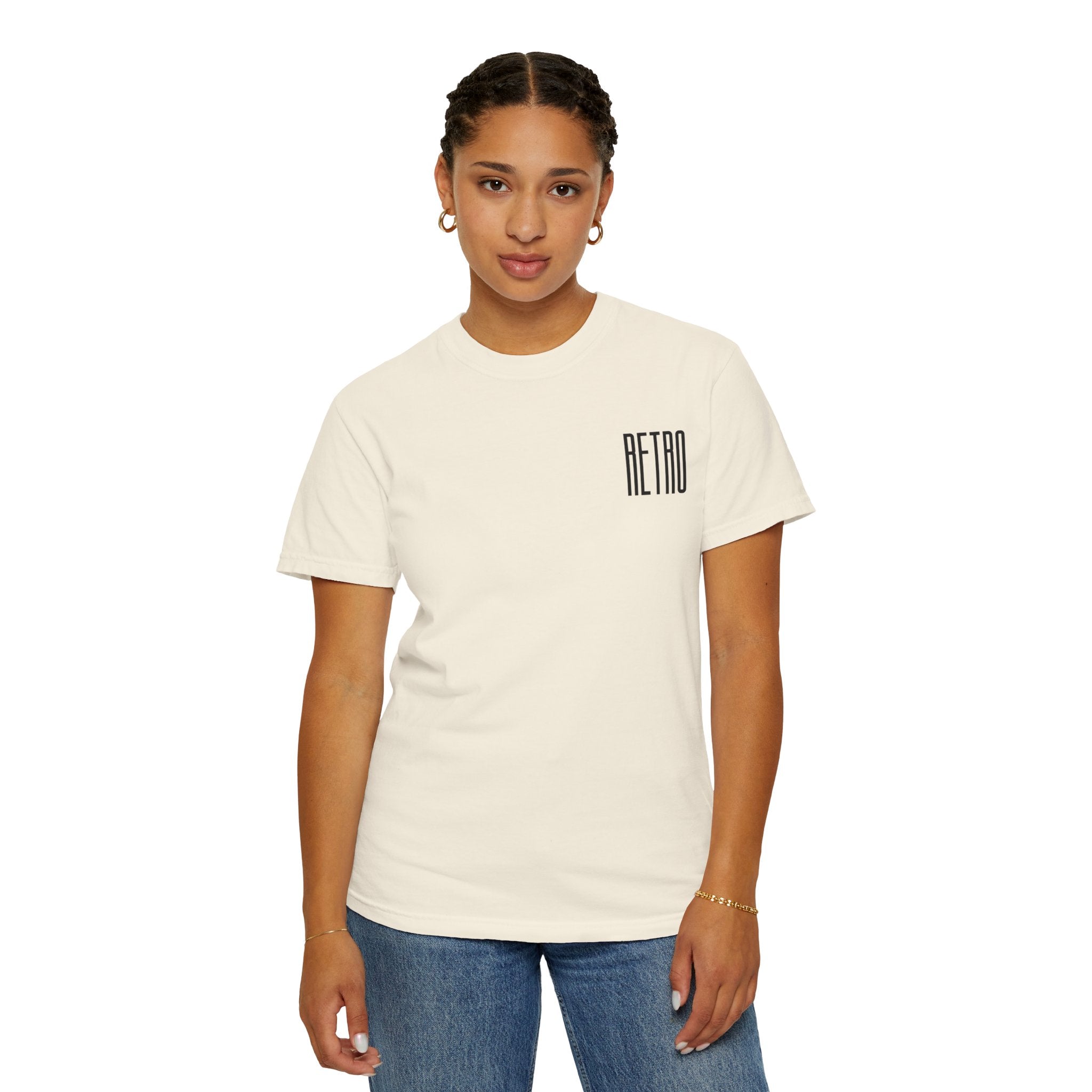 Person wearing a cream t-shirt with 'RETRO' text on a white background