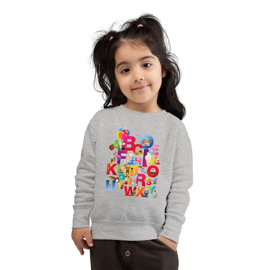 Child wearing a gray sweatshirt with colorful letters on a white background